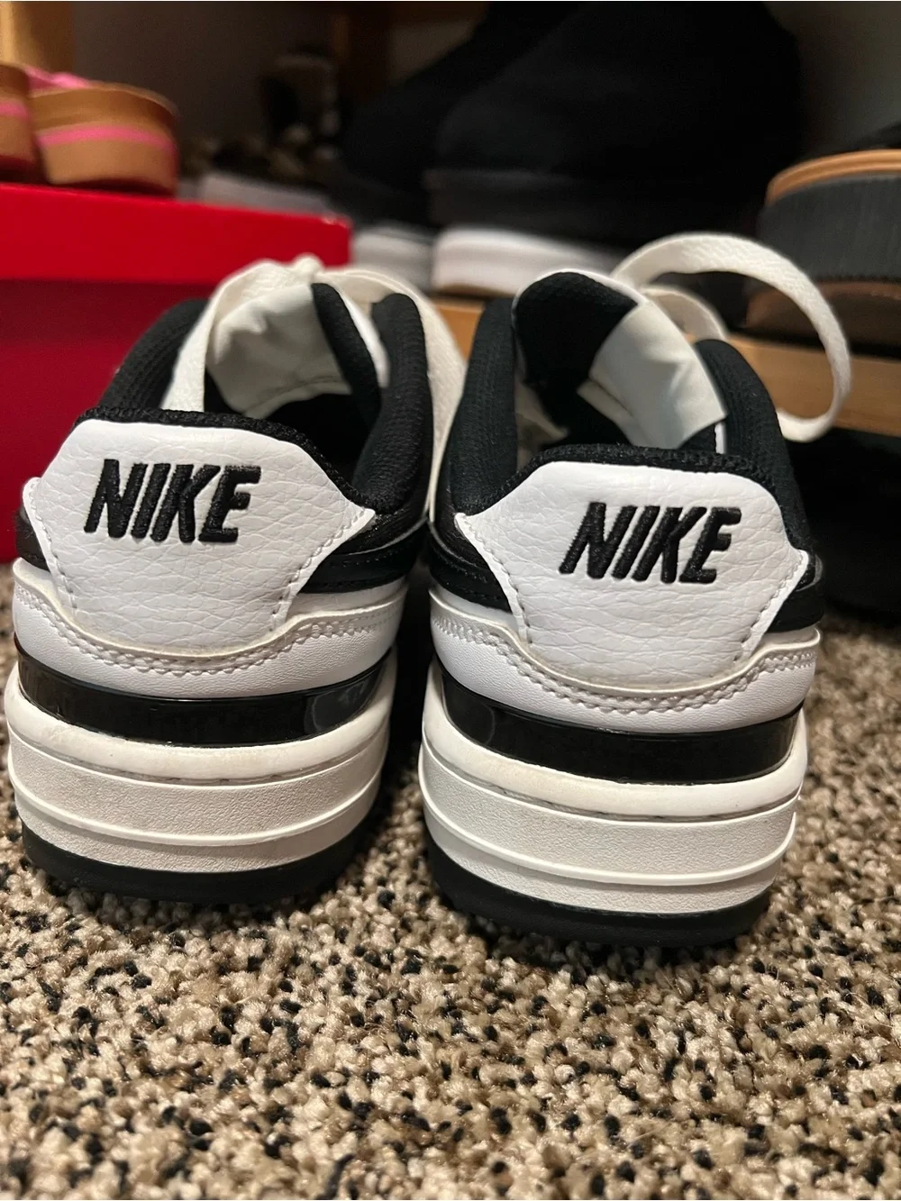 Nike Women's White Sneakers with Black Swoosh
